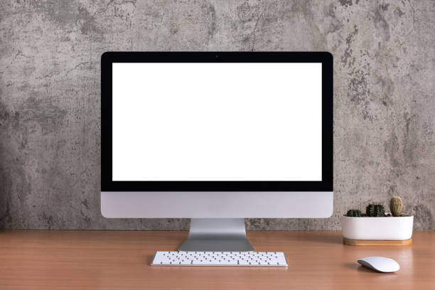 istock Blank screen of all in one computer with cactus vase on raw concrete background 1085986402