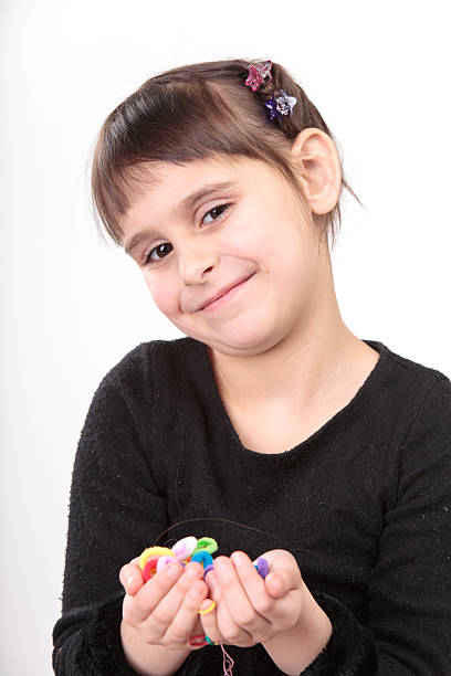 Small boy having fun while playing cards at home.