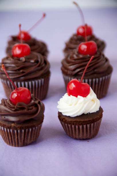istock Chocolate Cupcakes with Maraschino Cherries 1085988172