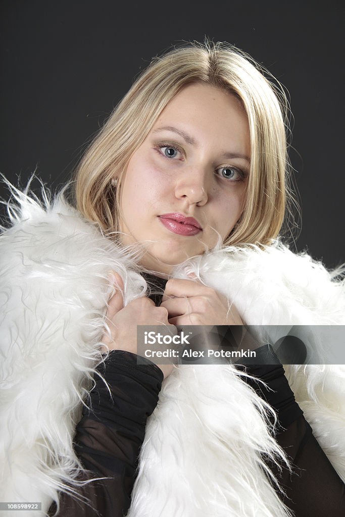 Youth blonde girl with the white fur Adult Stock Photo