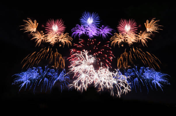 istock celebration colorful fireworks abstract background in the dark sky with copy space for festival holiday countdown to Happy New Year party in the park at night. 1086000766