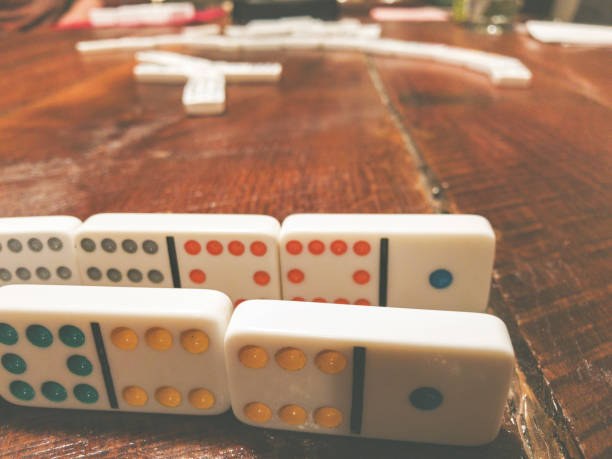 istock Holidays Dominoes Table Group Game Mexican Train 1086005522