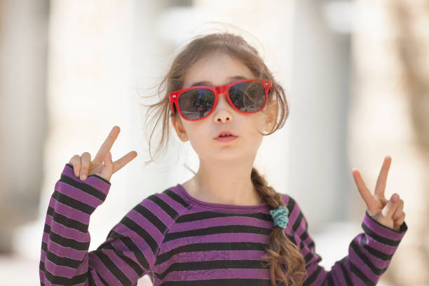 istock Little girl in sunglasses on a walk 1086006014