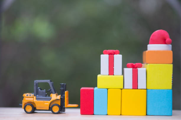 istock Forklift truck with Christmas gift box. Delivering presents concept 1086011840