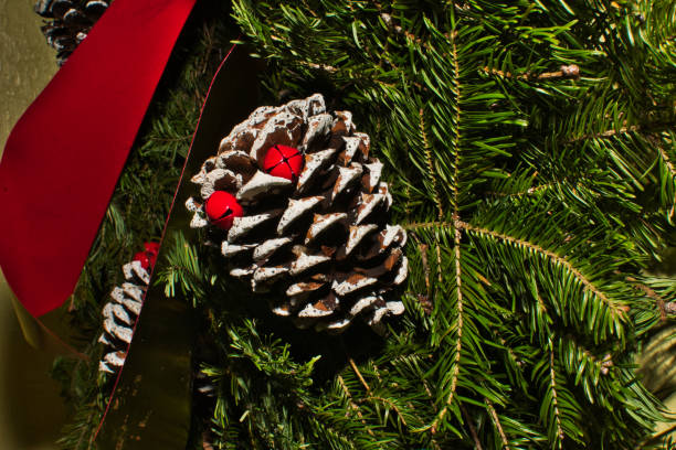 istock Pinecone with Red Ribbon and Bells 1086013770