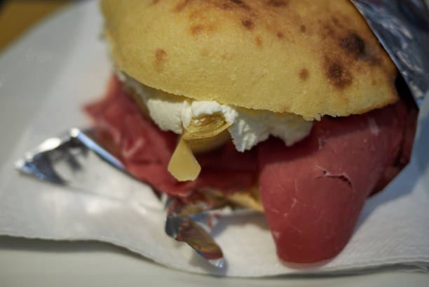 istock Puccia with parma ham, cheese and artichoke 1086020616