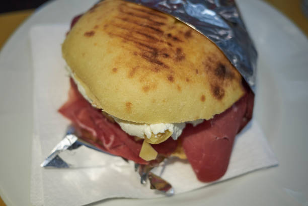istock Puccia with parma ham, cheese and artichoke 1086020620