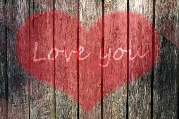 istock Valentine's day background. Old wooden board with hearts. 1086026670