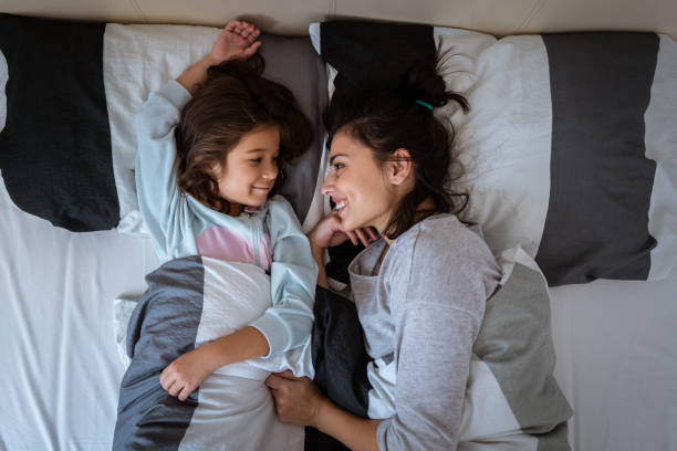 istock Mother and daughter spending lazy morning in bed 1086027272