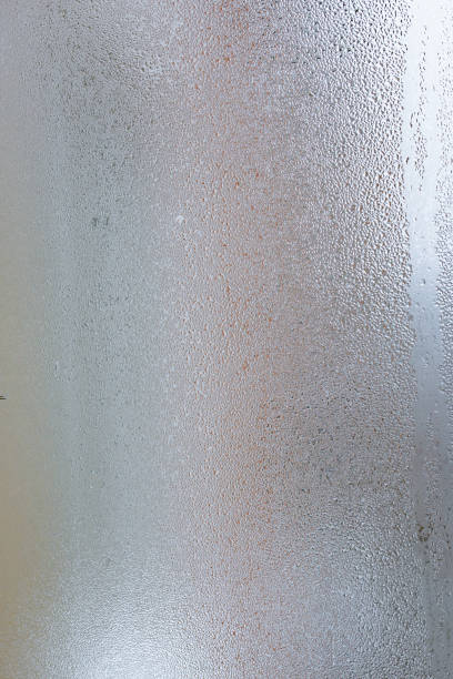 istock Natural water drop background, window glass with condensation humidity, large droplets flow down. Collecting and streaming down 1086027556