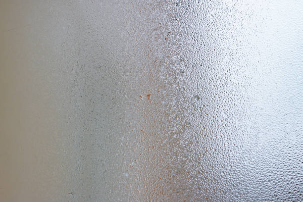 istock Natural water drop background, window glass with condensation humidity, large droplets flow down. Collecting and streaming down 1086027566