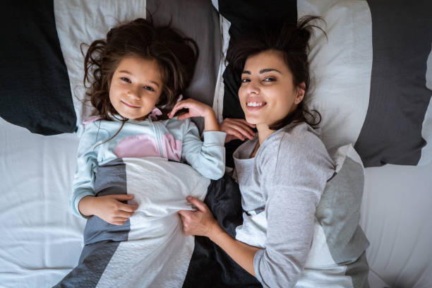 istock Mother and daughter spending lazy morning in bed 1086027598