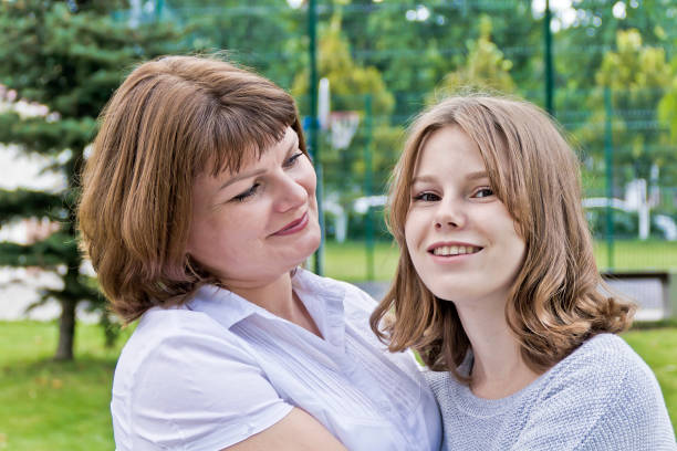 happiest mother and daughter fourteen years old - 12 13 years pre adolescent child female blond hair imagens e fotografias de stock