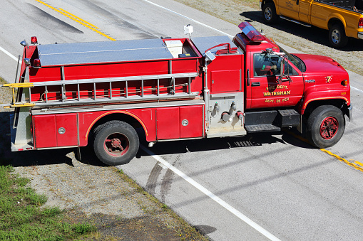 Fire truck at accident scene Close to Saint Martin on Highway 101, Nova Scotia, Canada. Trucker lost control of vehicle. Vehicle on its side.