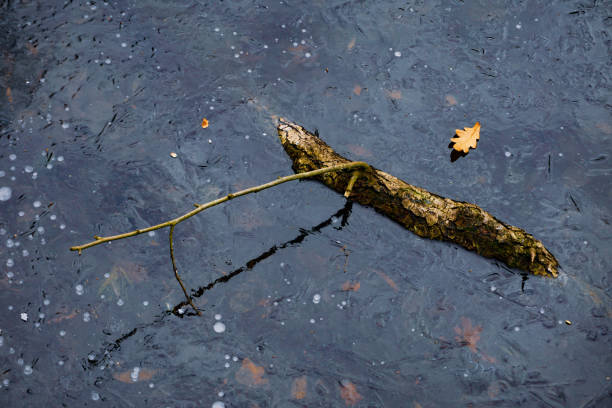 istock Reflection of a curved stick in the blue ice surface 1086041972