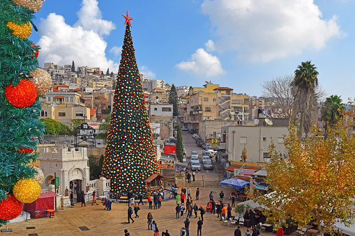 nazareth, israel - december 23: people celebrate the christmas, near the greek orthodox church of the annunciation in nazareth, israel, december 21, 2018