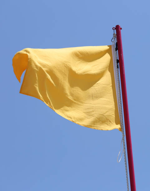 istock Big yellow flag waving to alert attention 1086051274