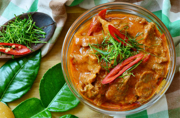 Thai menu Panaeng Curry with beef Thai menu  Panaeng Curry with beef and fresh kaffir lime leaves,coconut sugar and sliced chili .
Beef in ground peanut-coconut cream curry. kaffir stock pictures, royalty-free photos & images