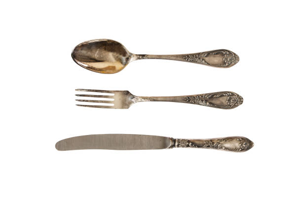 istock Silver cutlery set with fork, knife and spoon isolated on a white background. 1086055866
