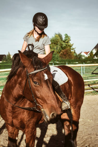 istock Girl riding a horse 1086058382