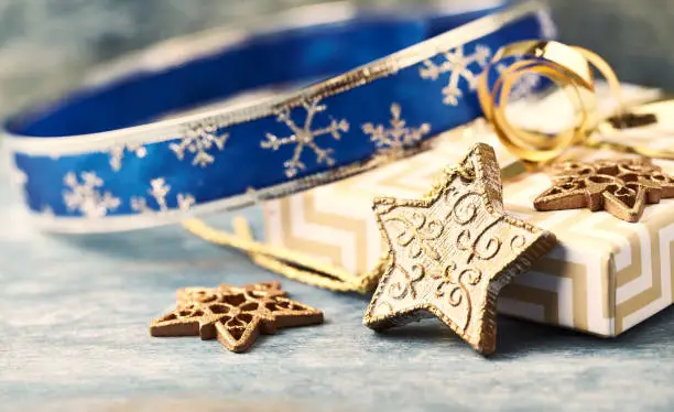 Christmas star and Christmas presents. Christmas decoration. Christmas time. Wooden background. Close up.