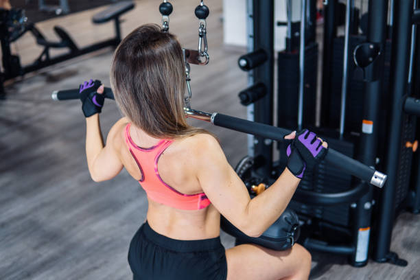 istock Young fit woman doing workout exercise in gym 1086060484