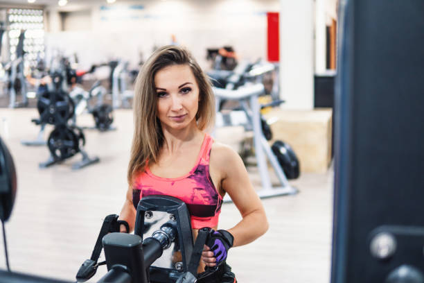 istock Young fit woman doing workout exercise in gym 1086061968