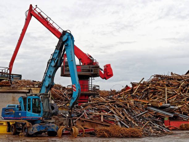 istock scrap metal heap with crane 1086068742