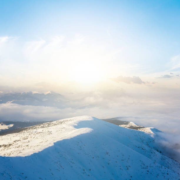 istock evening scene, mountain ridge in a snow at the sunset 1086069914
