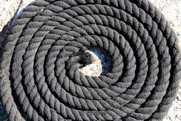 istock Twisted black sea rope. Nautical marine background. 1086072300