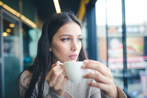 istock women who is enjoy in cafe 1086074030