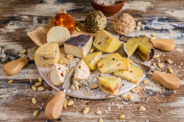 istock Various types of author's cheese on a wooden background 1086081502