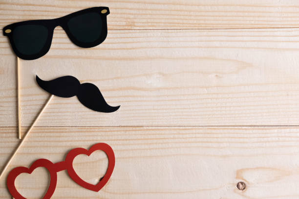 istock Basis for banner with mustache props and glasses for photos. Frame for text with paper mustache and glasses. Frame for children's cards. Banner of photographing and children's holiday, evening parties 1086083902