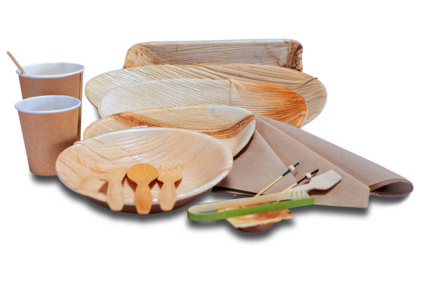 istock Set with wooden disposable tableware with plates and cutlery picnic 1086085190