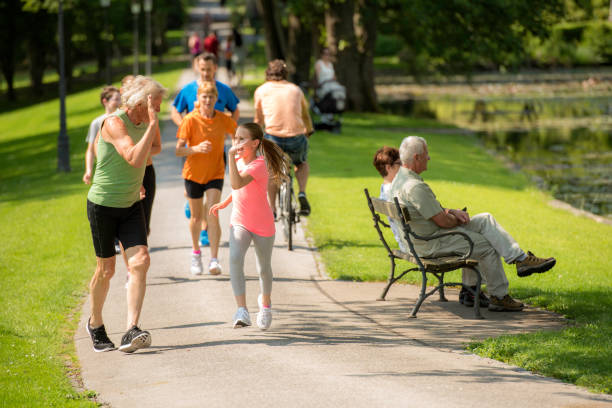 istock Grandfather and granddaughter high five while running 1086089512