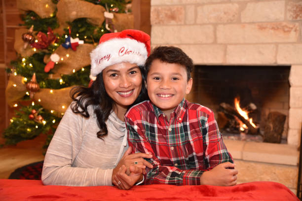 Mother and son boy  celebrating Christmas in a cozy cabin Plaid shirt, big smile hot filipina women stock pictures, royalty-free photos & images