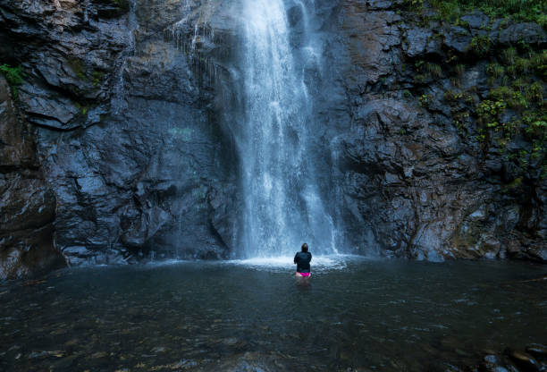 Woman swimming in waterfall near Artvin, Turkey