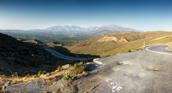 Scenic view of road and mountain, Crete, Greece