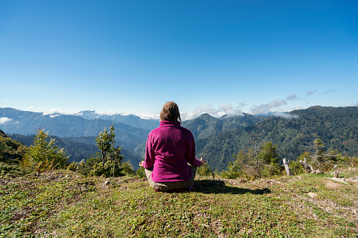 Woman meditating on a hill, Black Sea Region, Turkey