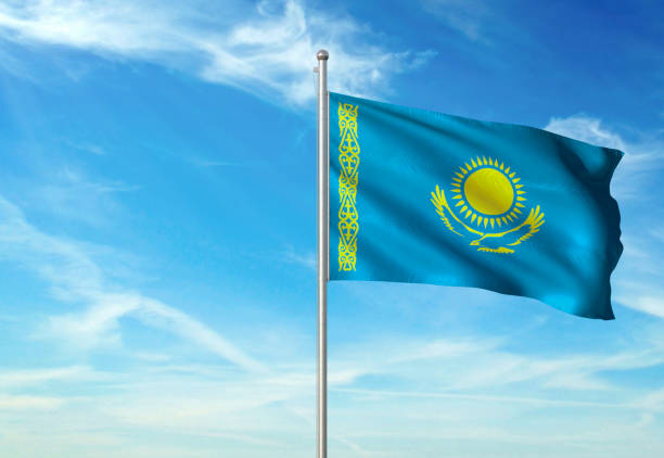 istock Kazakhstan flag waving cloudy sky background 1086106420