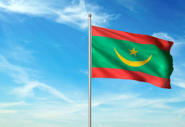 istock Mauritania flag waving cloudy sky background 1086106482