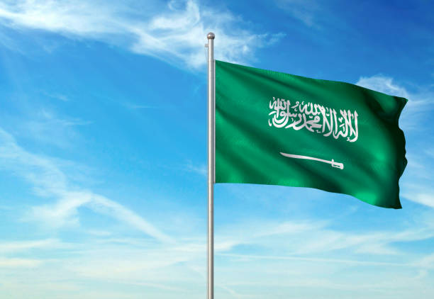 istock Saudi Arabia flag waving cloudy sky background 1086106624