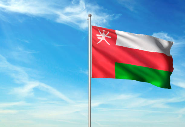 Oman flag on flagpole waving cloudy sky background realistic 3d illustration with copy space