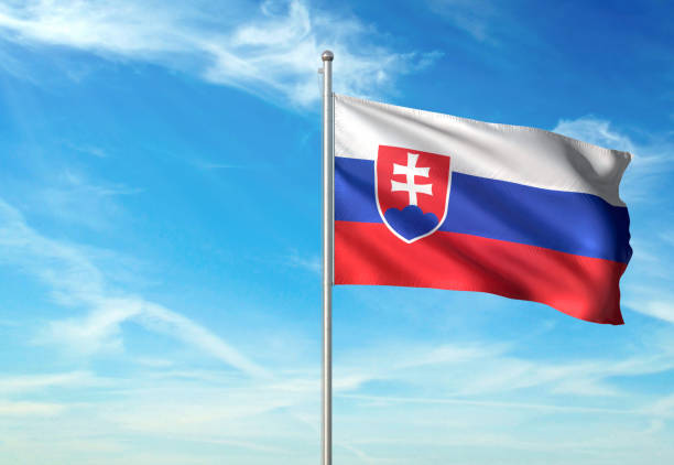 istock Slovakia flag waving cloudy sky background 1086109822