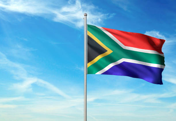 South Africa flag waving cloudy sky background South Africa flag on flagpole waving cloudy sky background realistic 3d illustration with copy space south africa flag stock pictures, royalty-free photos & images