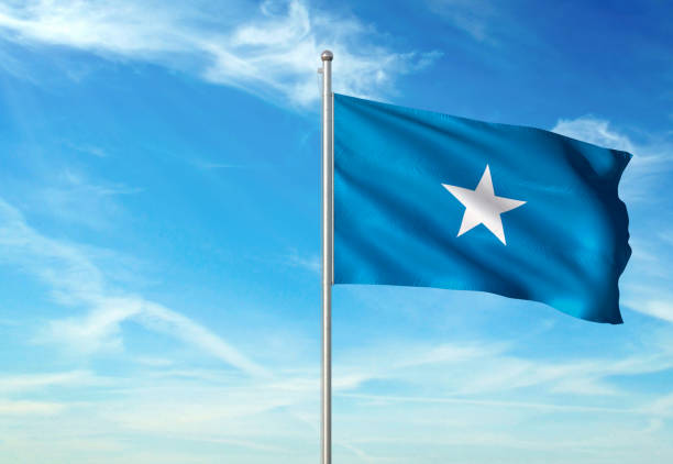istock Somalia flag waving cloudy sky background 1086109838