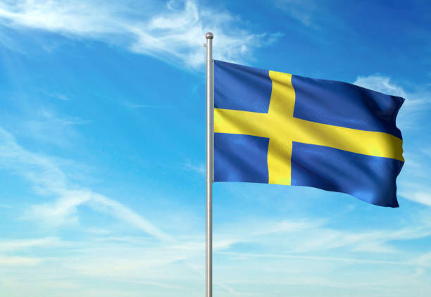 sweden flag waving cloudy sky background - day sky swedish flag banner imagens e fotografias de stock