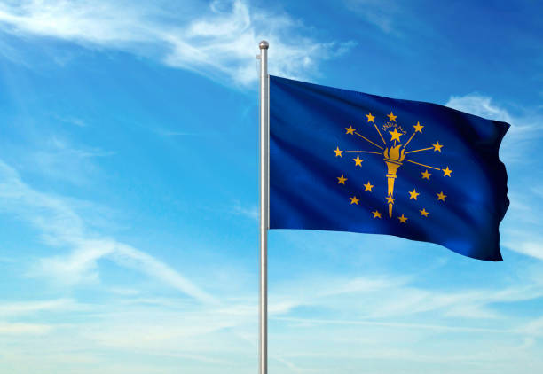 Indiana state of United States flag waving cloudy sky background Indiana state of United States of America flag on flagpole waving cloudy sky background realistic 3d illustration seal of the state of indiana stock pictures, royalty-free photos & images