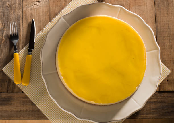 Lemon Cheesecake on wooden table background.