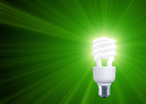 Green Shine of Compact Fluorescent Light Bulb. Business background. 3D render. The image can be croped easily.